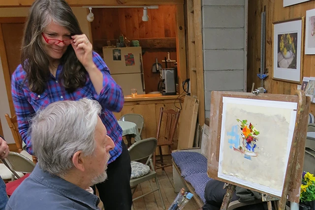 Carol Arnold talking with Richard about his painting underway.