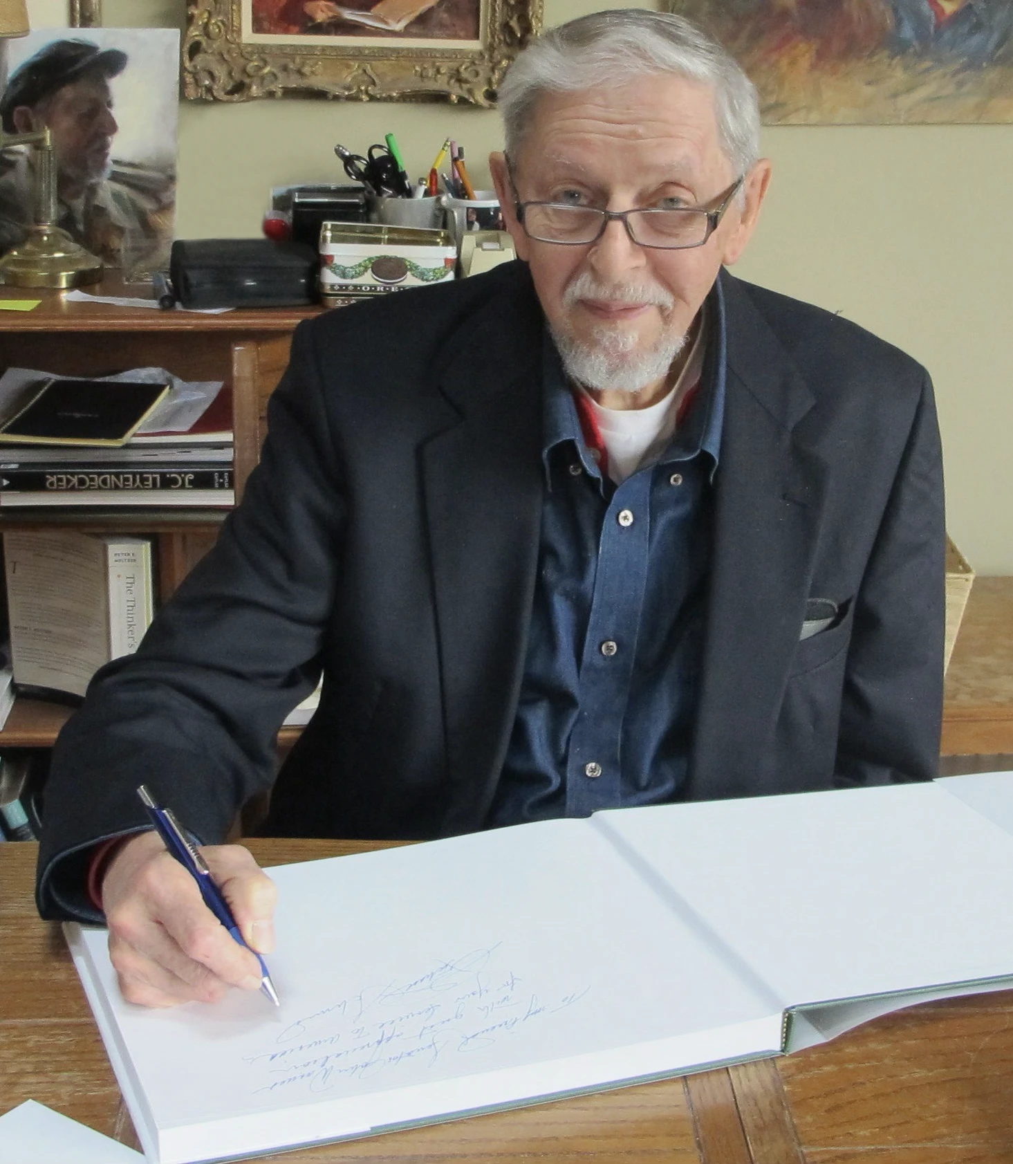 Richard Schmid autographing one of his books.